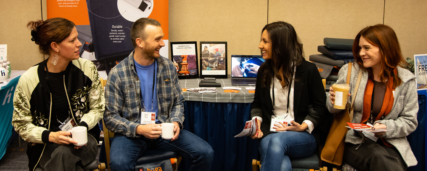 Huga members talking, Photo Credit: Focus Photography