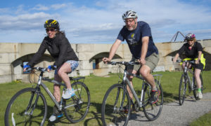 Group Biking near Lighthouse, Photo Courtesy of Summer Feet Cycling