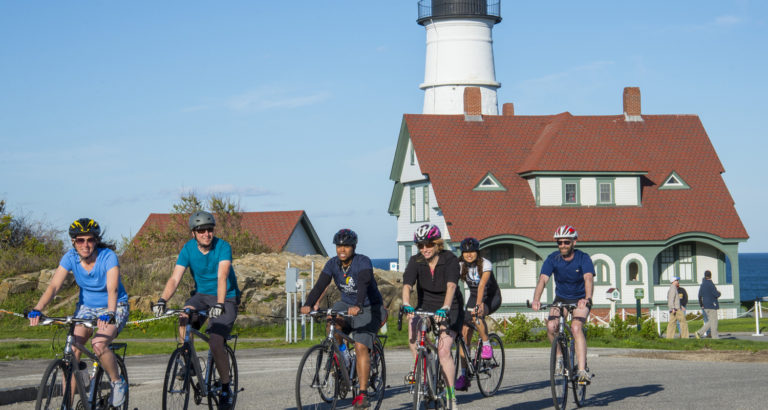 Group Biking near Lighthouse, Photo Courtesy of Summer Feet Cycling