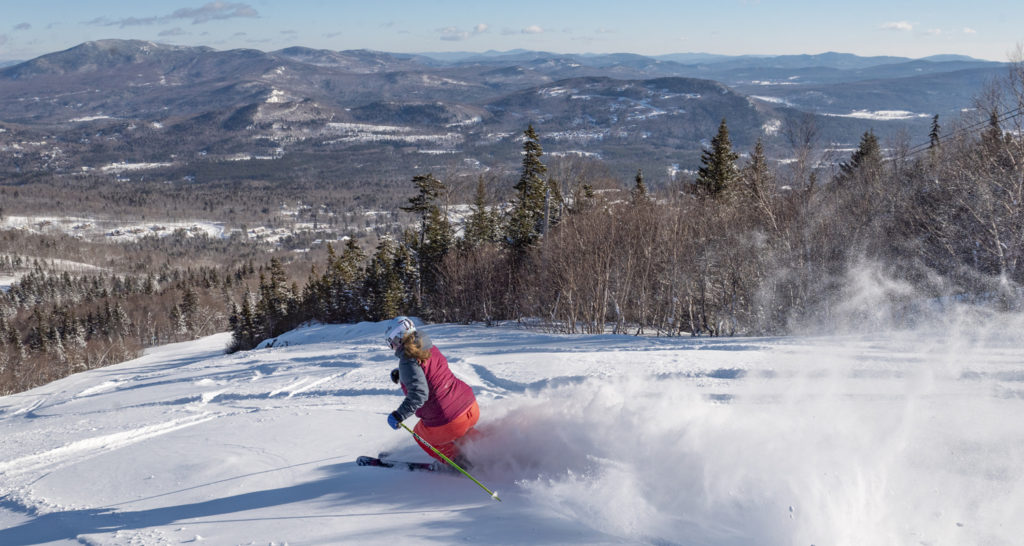 Skiier going down the slopes, Photo Courtesy of Sunday River