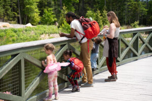 Family on Bridge. Photo Courtesy of Coastal Maine Botanical Gardens
