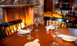 Table by Fireplace. Photo Provided by Boone's Fish House & Oyster Room.