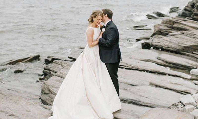 Wedding Couple on Rocks. Photo Provided by Black Point Inn