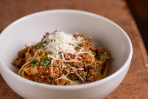 Fettuccini Bolognese at The Corner Room. Photo Credit: Anthony DiBiase Photography