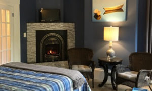 Blue bedroom with fireplace, Photo Courtesy of Percy Inn