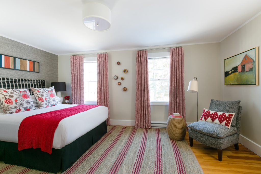 Guest room with a bed and seating area. Photo Credit: Rarebrick Photography Guest room with a bed and seating area. Photo Credit: Rarebrick Photography