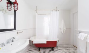 Bathroom with a clawfoot tub. Photo Credit: Rarebrick Photography