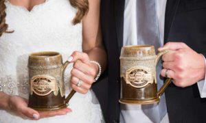 Wedding Couple with Beer Mugs. Photo Provided by Inn on Peaks Island