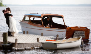Just Married Boat, Couple on Dock. Photo Provided by Migis Lodge on Sebago Lake