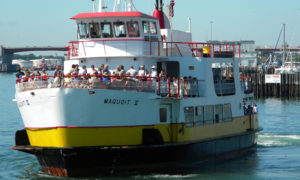 Exterior of ferry with people on board. Photo Provided by Casco Bay Lines