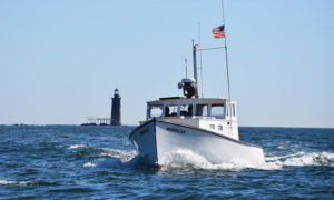 Boat on water. Photo Provided by Casco Bay Custom Charters
