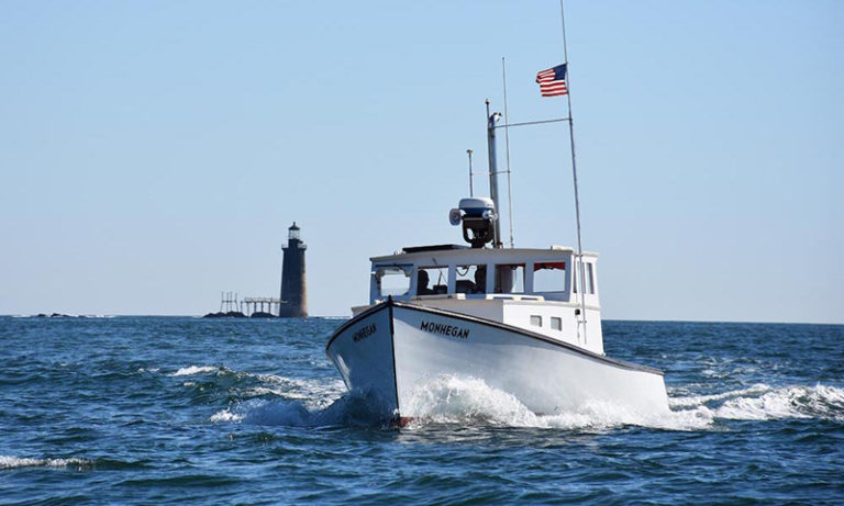 Boat on water. Photo Provided by Casco Bay Custom Charters
