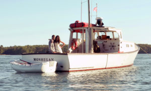 Wedding couple on boat. Photo Provided by Casco Bay Custom Charters