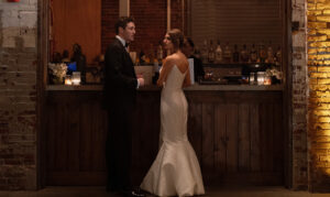 Wedding Couple at Bar. Photo Credit: Brad Bahner