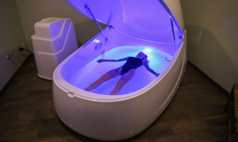 Person laying in tub. Photo Provided by Float Harder Relaxation Center
