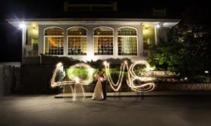 Wedding Couple in Front of Stage Neck Inn. Photo Provided by Focus Photography