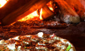 Pizza in Oven. Photo Provided by Flatbread Pizza