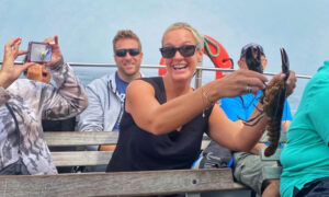 Girl with Lobster. Photo Credit; Experience Maine Girl with Lobster. Photo Credit; Experience Maine