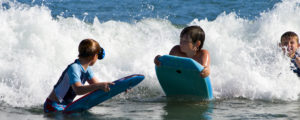Kids Playing in Ocean Waves, Photo Credit: Cynthia Farr-Weinfeld