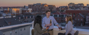 Group Having a Drink on Rooftop Deck, Photo Credit: Cynthia Farr-Weinfeld