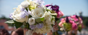 Bridesmaids Row of Purple Flowers, Photo Credit: Focus Photography