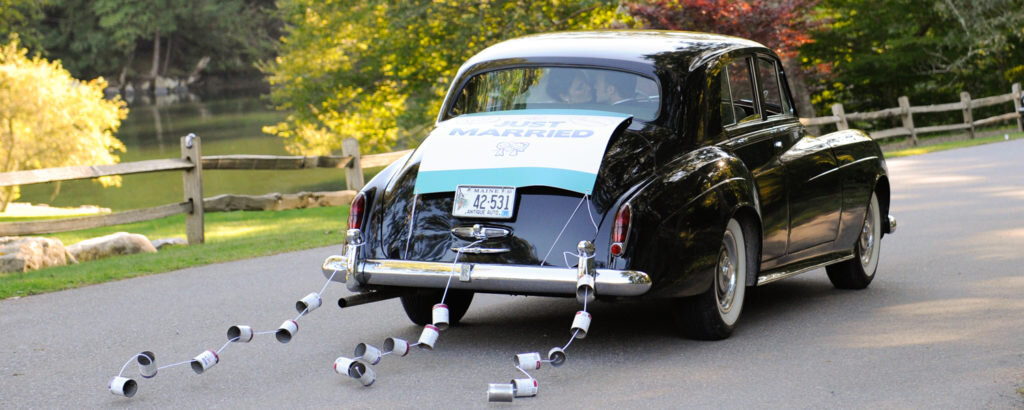 Car Driving Away After Wedding, Photo Credit: DeManio Photography
