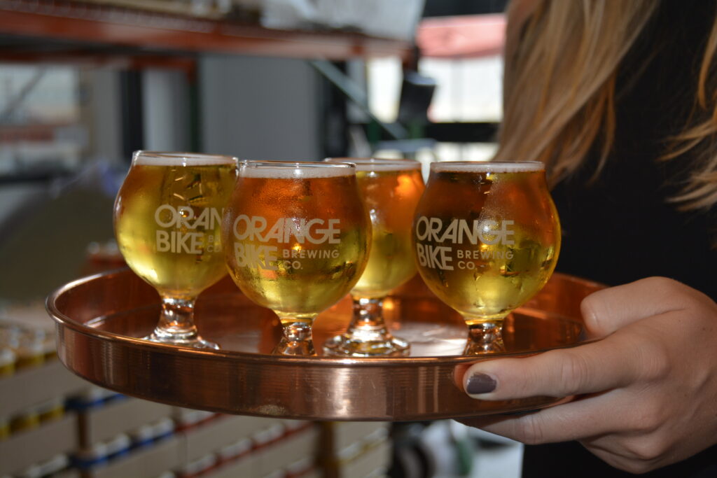 Tray with glasses of beer. Photo Credit: Harleigh gastman