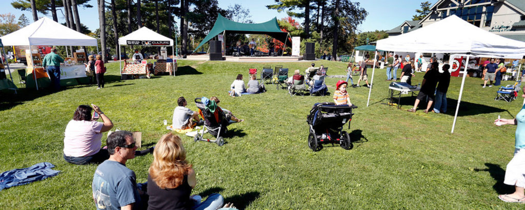 Crowds relaxing on lawn at Freeport Fall Festival, Image provided by Visit Freeport