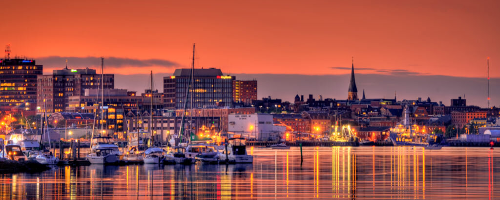 Portland Maine Downtown City Lights at Sunset Over Marina Boat Yard, Photo Credit: Kim Seng