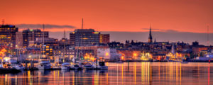 Portland Maine Downtown City Lights at Sunset Over Marina Boat Yard, Photo Credit: Kim Seng