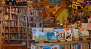 Book Display with Tree Mural Behind, Photo Courtesy of treehouse Toys via emilybizpics