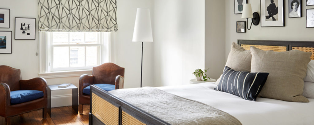 King Bedroom with Wall Art and Chairs, Photo Courtesy of Read McKendree and Lark Hotels