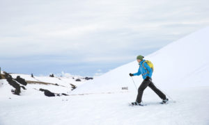Snowshoeing in Freeport, Maine surrounded by hills, photo courtesy of Visit Freeport