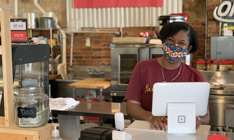 Woman in mask at Yardie Ting Photo Courtesy of Adam MacDonald