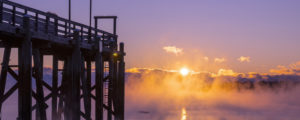 Seasmoke and sunset over Falmouth town landing, Photo Credit: CFW Photography