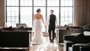 Couple Looking out Window at Wedding, Photo Credit: Jessie Felix Photography via The Westin