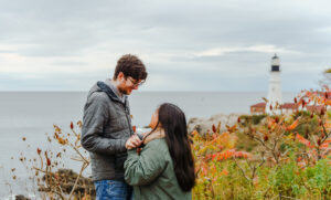 Couple Getting Engaged by Portland Head Light. Photo Credit: Sravya Khasnavees