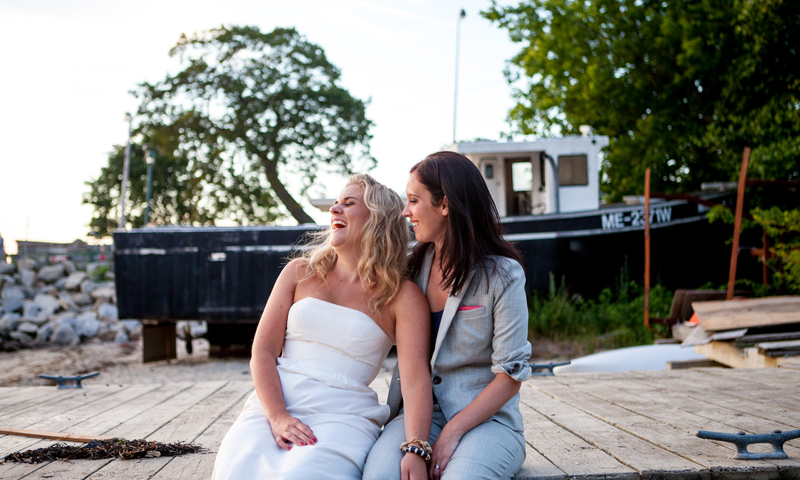 Couple at Wedding Outside Behind Boat, Photo Credit: Emilie Inc.