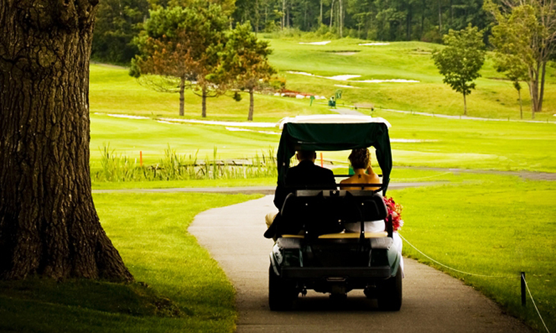 Couple in Golf Cart, Photo Credit: Focus Photography