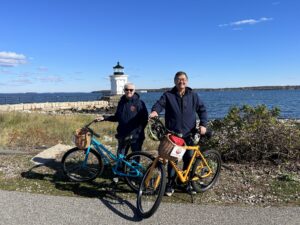 Biking by Lighthouse. Photo Credit: Leah Day