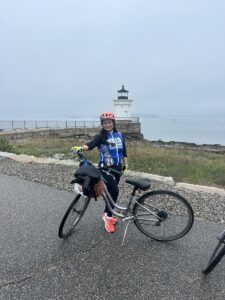 Biker at Lighthouse. Photo Credit: Leah Day