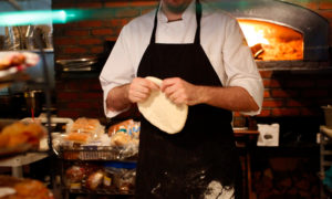 Chef Tossing Pizza Dough at Freeport Restaurant, Photo Courtesy of Visit Freeport