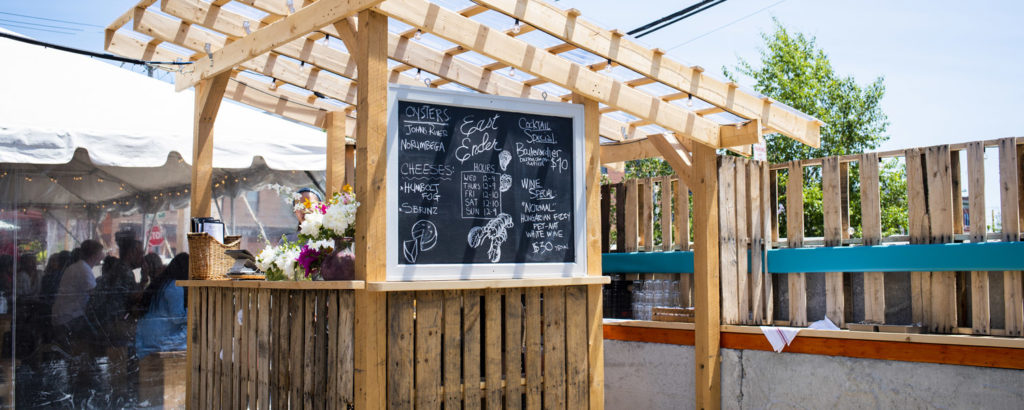 Outdoor Seating at East Ender. Photo Credit: Capshore Photography