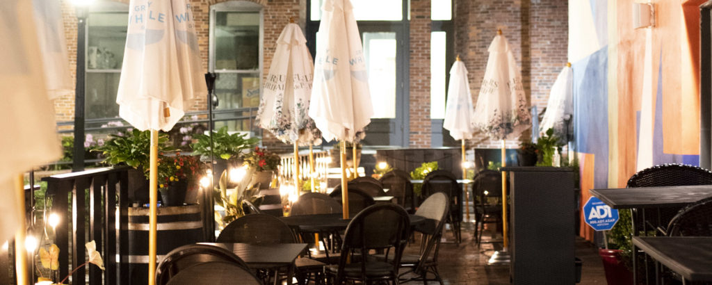 Outside seating in Portland at night. Photo Credit: Capshore Photography