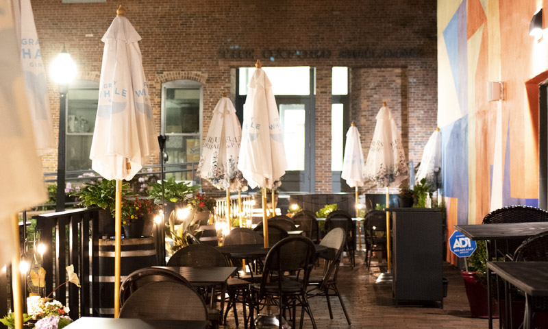 Outside seating in Portland at night. Photo Credit: Capshore Photography