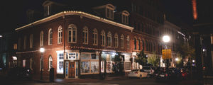 Downtown Portland storefront at night. Photo credit: Capshore Photography
