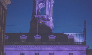 Pride Flag at Merrill Auditorium at night. Photo Credit: Capshore Photography