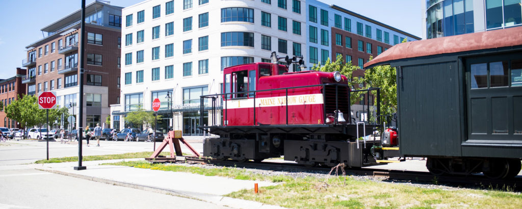 Maine Narrow Gauge in front of Ocean Gateway. Photo Credit: Capshore Photography