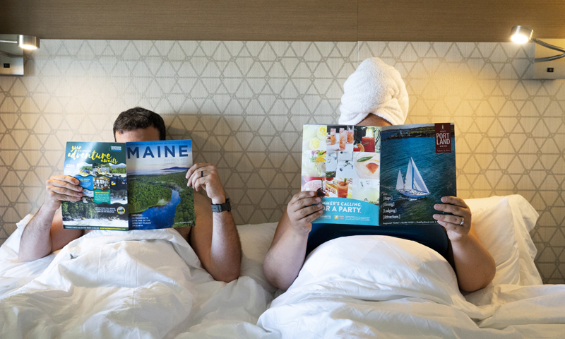 Lounging in Bed with Magazines, Photo Credit: Capshore Photography