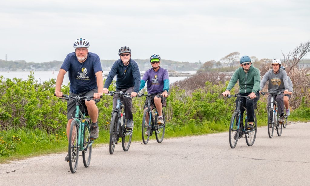 Group riding along the shore, Photo Credits: Melissa Samson Group riding along the shore, Photo Credits: Melissa Samson